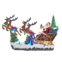 Kurt Adler 8.7-Inch Battery-Operated LED Musical Santa And Sleigh Table Piece